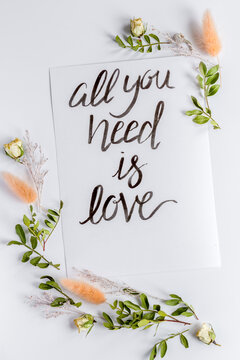 calligraphy floral pattern top view all you need is love