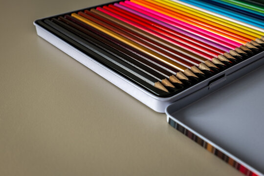 Colorful Pencils Arranged in an Open Metal Art Tin