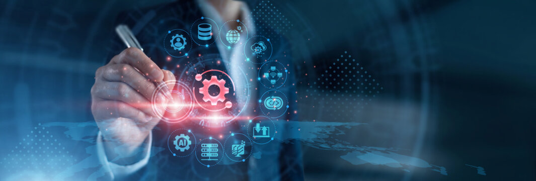 Software deployment. Systems engineer pointing using pen reviewing continuous integration pipelines, microservices telemetry, and automated delivery code metrics on cloud control dashboard.