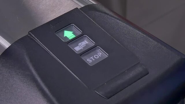 A person approaches a sleek entry system, eagerly swiping a card over the reader. The green light glows, signaling access granted. Moments later, the door opens smoothly to welcome guests inside.