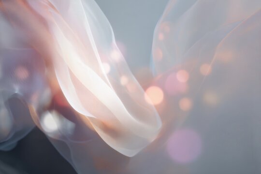 Ethereal flowing fabric abstraction with soft bokeh lights for elegant background and banner design