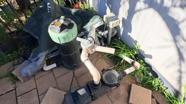 Filtration equipment for a residential swimming pool. The powerful electric motor circulates water through the pump and sand filter