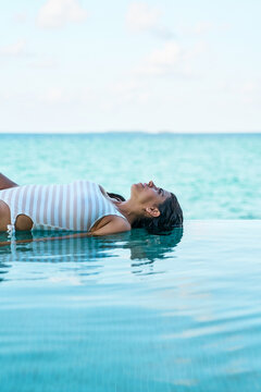 A white woman floats peacefully
