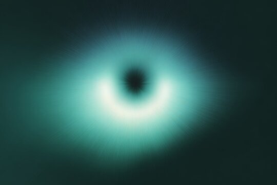 Turquoise radial glow nucleus with dark center for futuristic abstract wallpaper background and atmospheric digital backdrop design