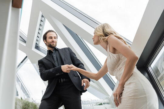 A beautiful couple shares a joyful moment celebrating their engagement 