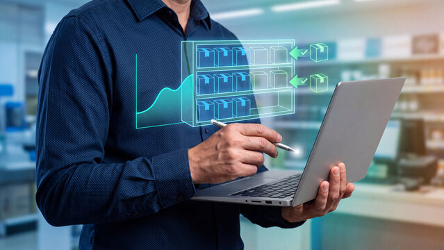 Inventory Management and Stock Replenishment Concept, businessman using laptop with holographic warehouse shelves, restocking boxes and stock level graph for supply chain optimization