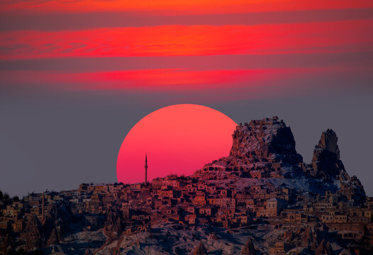 Hot air balloon flying over spectacular Cappadocia at sunset - Goreme, Turkey