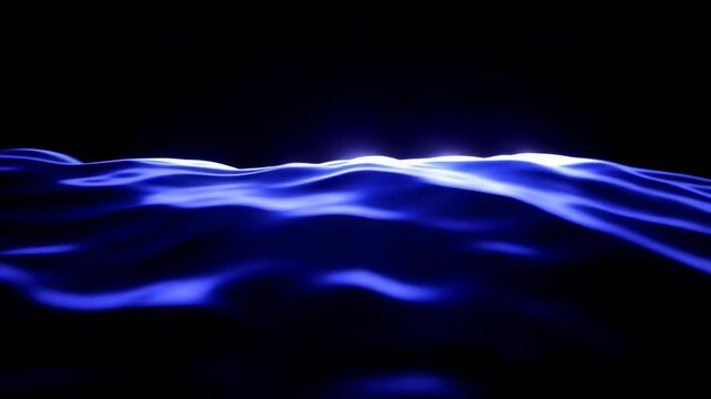 Blue ocean waves gently rolling under soft light, creating a serene atmosphere against a dark background, showcasing the fluid motion of water in a tranquil setting