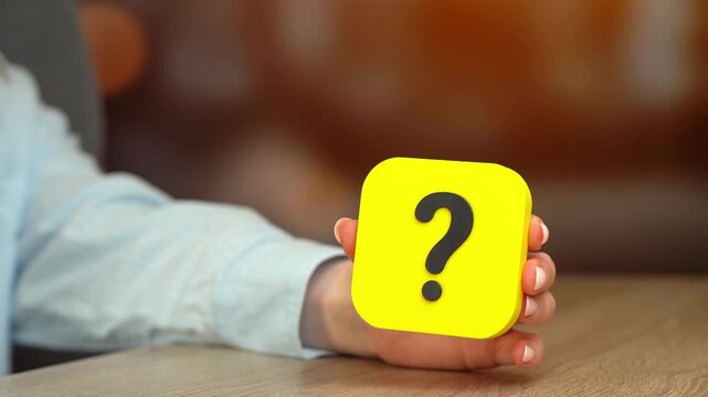 A businesswomen holds a question mark in his hands. Looking for an answer. Search and analysis, analytics and study. Pay attention to details and problems. Find something. Journalistic investigations