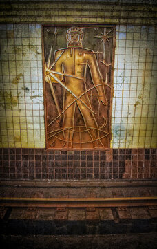 Moscow, Russian Federation, Europe: metal panel of a stylized cosmonaut, part of the Space themed decorations at the Taganskaya metro station
