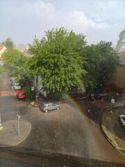 Fototapeta premium Rainbow Over Wet City Street