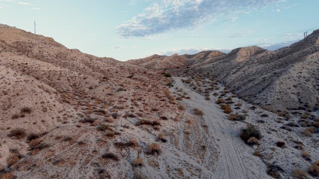 Low Altitude flight between sand dunes just above the wash. Stay for the ending, a cinematic rise into the sky revealing a vast Mojave Desert