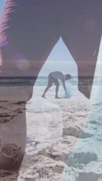 Animation of african american man over african american couple segregating waste at beach