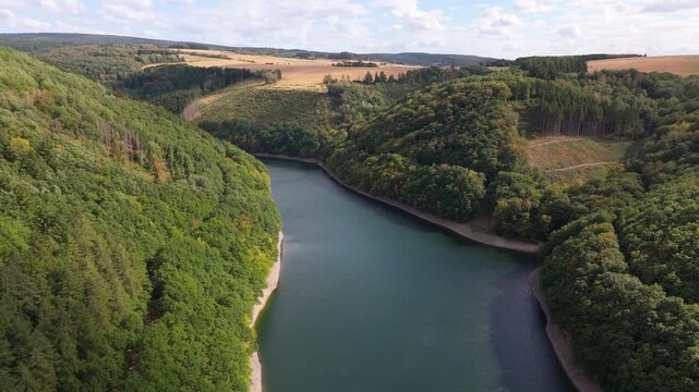 Riveris Dam, drinking water protection area, reservoir surrounded by dense forest, provide for irrigation, hydropower, water supply, flood management, recreation, inland navigation, Trier, Germany