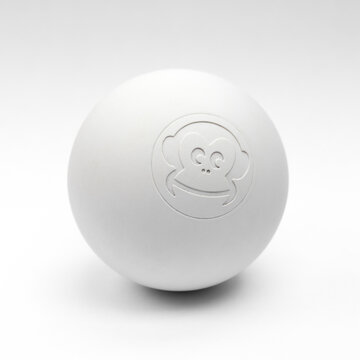 Captain-Lax white massage therapy lacrosse ball with monkey logo on seamless background