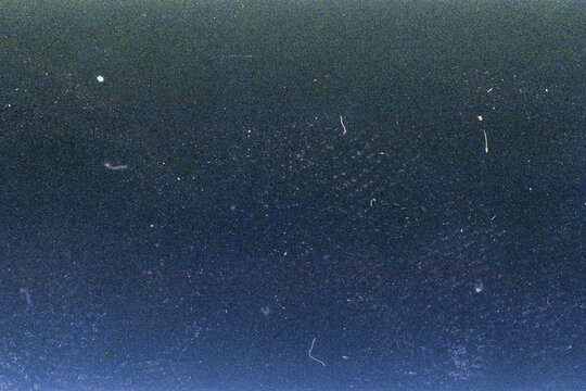 Blank grained film strip texture background with heavy grain, dust and light leak