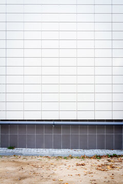 Modern white panel tile wall texture background. Architectural detail.