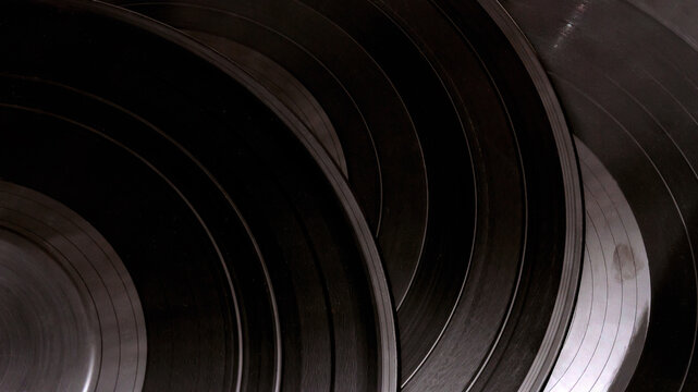 Group of black vintage records. Vinyl records texture, music background. View of phonograph records.