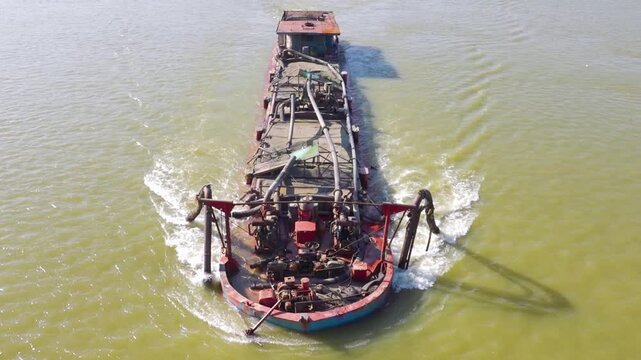 A dredger, a pump ship for extracting sand (sand recovery) from the river.