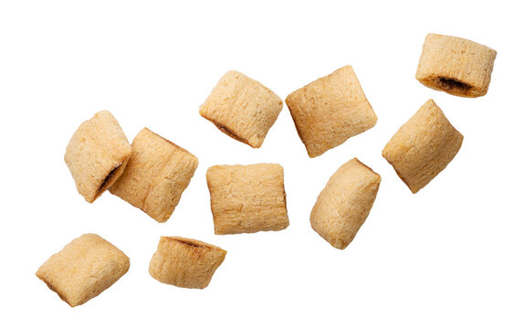 Cereal pads flying close-up a white. Isolated