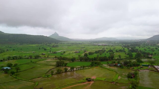 Scenic Aerial View of the Lush Green Landscape of Maharashtra During Monsoon, Rolling Sahyadri Hills, Dense Forests, Misty Mountains, Fresh Green Fields, Rain Clouds and Breathtaking Western Ghats Sce