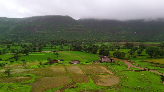 Scenic Aerial View of the Lush Green Landscape of Maharashtra During Monsoon, Rolling Sahyadri Hills, Dense Forests, Misty Mountains, Fresh Green Fields, Rain Clouds and Breathtaking Western Ghats Sce