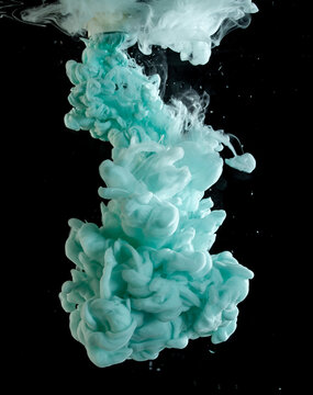 Swirling colors blend in water creating dynamic shapes