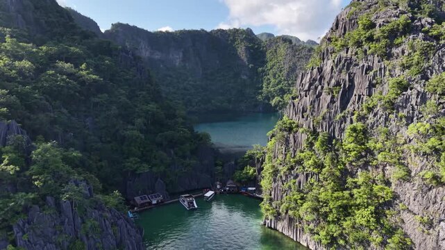 Aerial Drone View of Turquoise Lagoon Between Karst Limestone Cliffs in Coron Palawan Philippines 4K