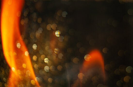Flames dance in the night at a cozy bonfire gathering