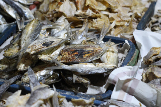 A pile of raw dried anchovies sold at a traditional Indonesian market
