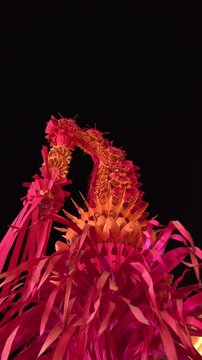 Red Tinted Penjor Bali at Night Celebration of Galungan Kuningan in the Dark Place Traditional Ceremony Indonesia