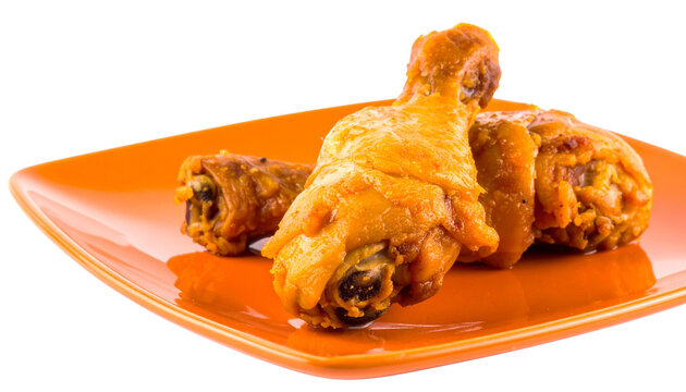 cooked chicken leg pieces in a plate, isolated on transparent background, PNG.