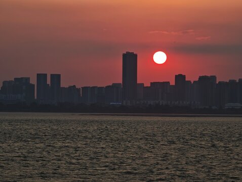 Sun Setting Over City Skyline on Yangtze River, Wuhan