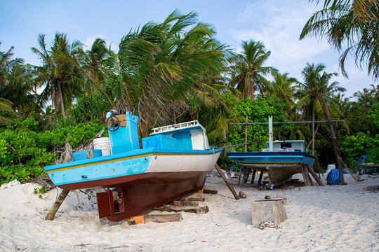 Traditional Maldivian Dhoni Boat On Tropical Beach