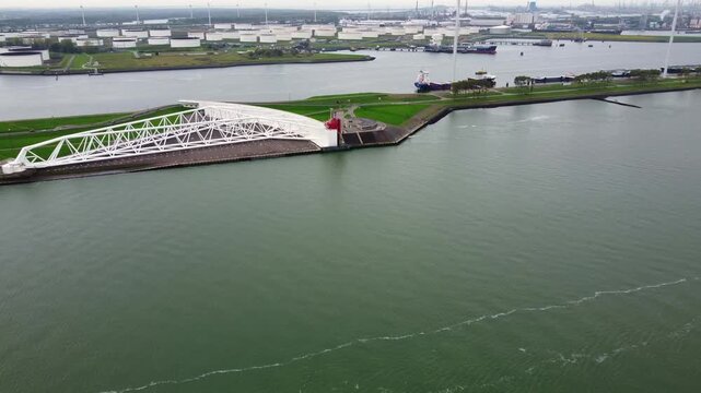 Maeslant Barrier (Maeslantkering), a movable storm surge barrier. Desta Works.Aerial view. Nieuwe Waterweg canal, entrance to the Port of Rotterdam, Netherlands.