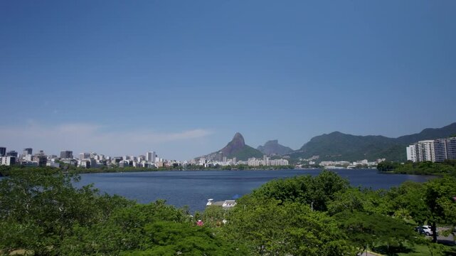 Drone footage of Rodrigo de Freitas lagoon in a sunny and beatiful day. Rio de Janeiro, Brazil.