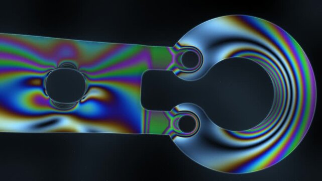 Photoelastic Stress Fringes Sweeping Across a Transparent Loaded Part Under a Dark-Field Polariscope, Seamless Loop in vibrant blue tones