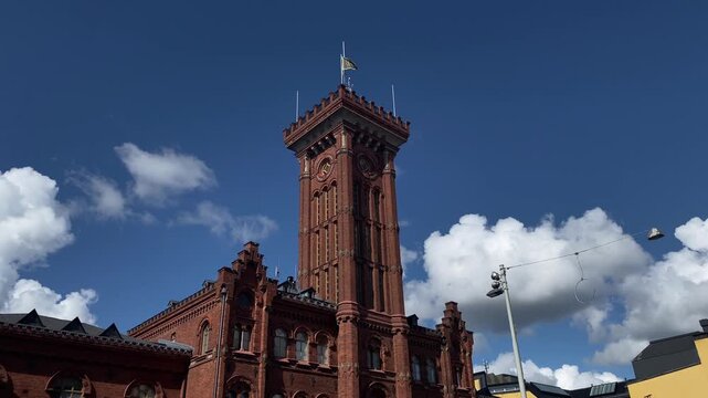 Historic red-brick fire station in central Helsinki, Finland, on a sunny summer day. A beautiful example of traditional urban architecture and cultural heritage. August 2026
