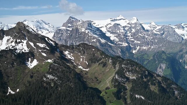 Aerial View of Snow-Capped Swiss Alps Peaks from Stoos Ridge Trail Cinematic Panoramic Landscape