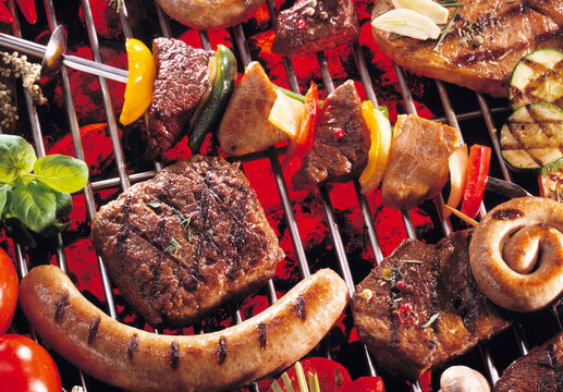 Meat and sausages on barbecue grill