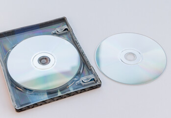 Fototapeta premium Two Blank Compact Discs and Open Case on White Background