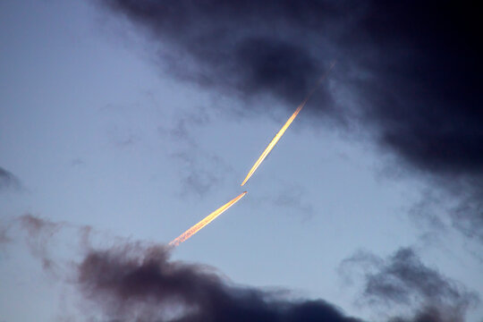 Airplanes with contrails crossing in the sky over Wuerzburg