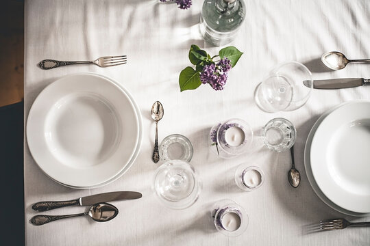Festive laid table with lilac, Syringa, view from above