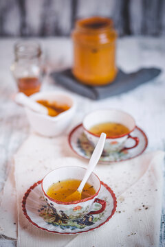 Hot Ayurvedic turmeric tea spiced with pepper in a cup indoors