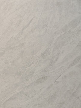 a smooth light grey slate stone surface featuring faint natural veins and subtle granular detail. Ideal for modern interior architecture design, kitchen countertop mockups, 