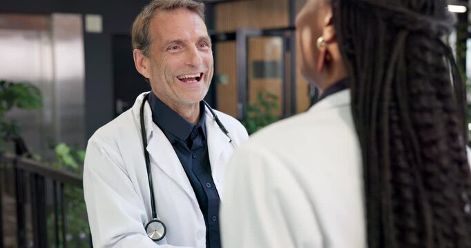 Mentor, man and handshake with doctors in hospital for thank you, healthcare and advice. Medical collaboration, shaking hands and meeting with people in clinic for consulting, help and support