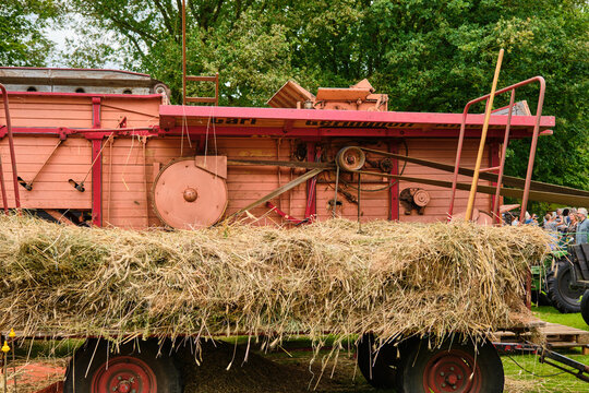 Agricultural heritage and harvest festival in Orvelte Netherlands vintage threshing machine with hay at Museumdorp Orvelte Westerbork Traditional farming equipment display