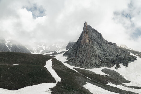 Solitary Granite Spire Pinnacle Against a Clearing Sky
