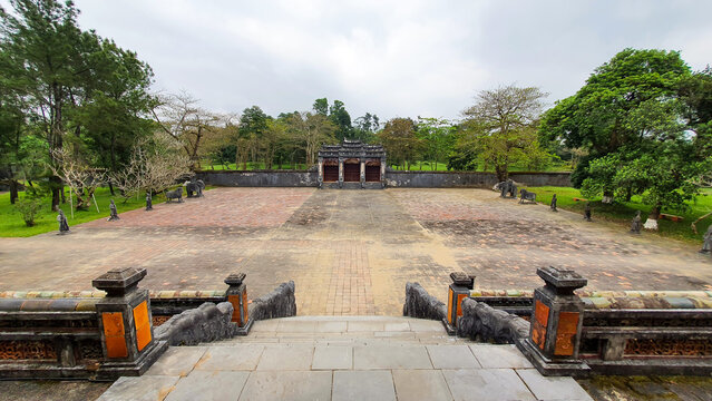 Hue, Vietnam - March 18, 2022 : Dai Hong Mon Gate and Imperial Architecture in the Courtyard at the Mausoleum of Minh Mang in Hue.