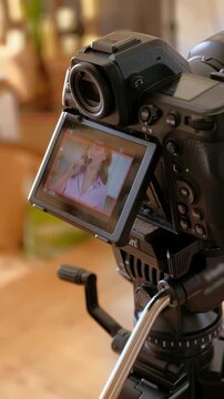 camera recording video of cheerful woman drinking red wine from a glass in slow motion.